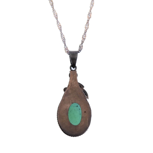 137 - A silver pendant mounted with a green hardstone polished en cabochon, upon a silver chain (boxed)