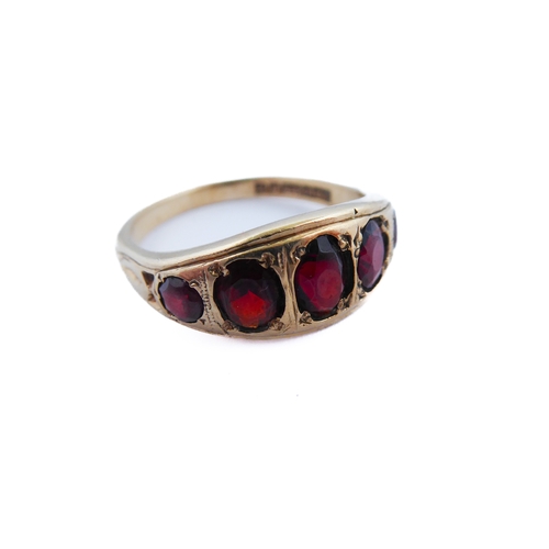 143 - A 9-carat gold gipsy-style ring set with five graduated garnets, ring size R/S