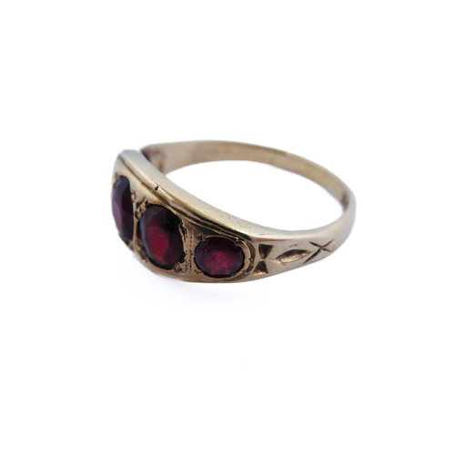 143 - A 9-carat gold gipsy-style ring set with five graduated garnets, ring size R/S