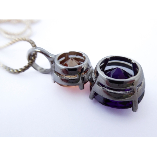 149 - A large silver amethyst and gemstone-set pendant and silver chain