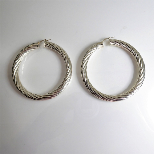 154 - A pair of oversized hallmarked silver spiral-twist style earrings (7cm diameter)