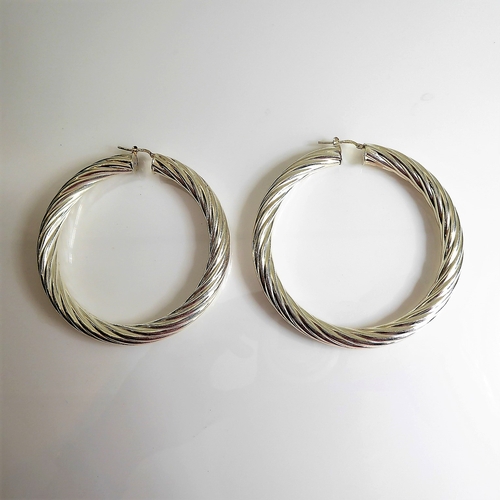 154 - A pair of oversized hallmarked silver spiral-twist style earrings (7cm diameter)