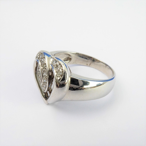 157 - An 18-carat white gold 'heart' ring set with diamonds, ring size N/O