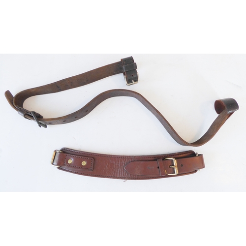 172 - An early 20th century Sam Browne belt, a heavy brass bridle buckle and two leather straps