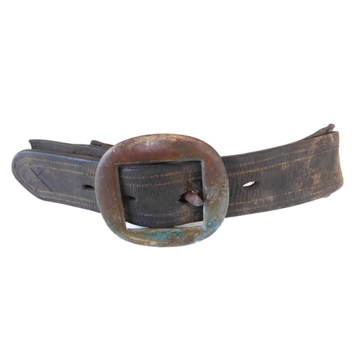 172 - An early 20th century Sam Browne belt, a heavy brass bridle buckle and two leather straps