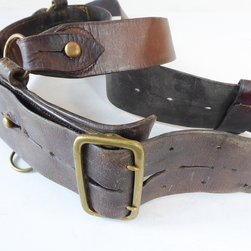 172 - An early 20th century Sam Browne belt, a heavy brass bridle buckle and two leather straps