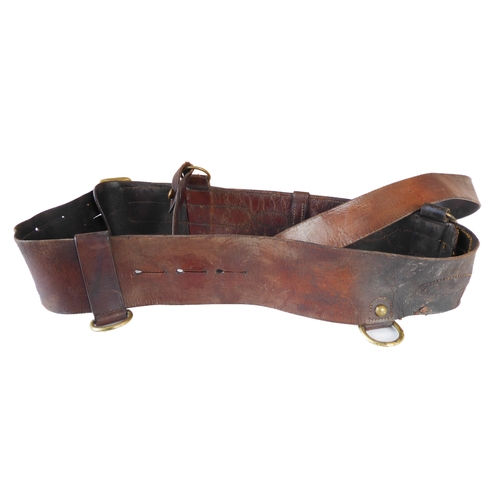 172 - An early 20th century Sam Browne belt, a heavy brass bridle buckle and two leather straps