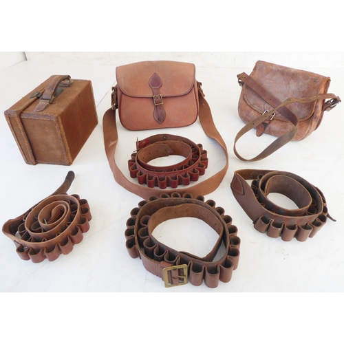 207 - A small cartridge magazine, two cartridge bags (one all-leather) and four cartridge belts