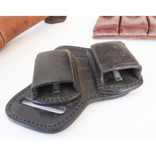 209 - Three leather pistol holsters and three leather magazine holders:
 a Bianchi 'Phantom' shoulder hols... 