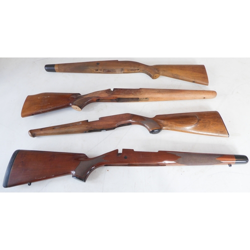 214 - Four sporting rifle stocks, one good walnut small-bore example with cheek-piece comb, capped Prince ... 