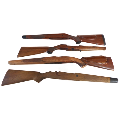 214 - Four sporting rifle stocks, one good walnut small-bore example with cheek-piece comb, capped Prince ... 