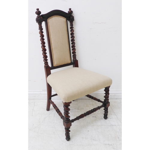 275 - A mid-19th century rosewood bedroom-style nursing chair of fine quality: arched top rail above two b... 