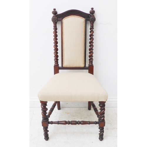 275 - A mid-19th century rosewood bedroom-style nursing chair of fine quality: arched top rail above two b... 