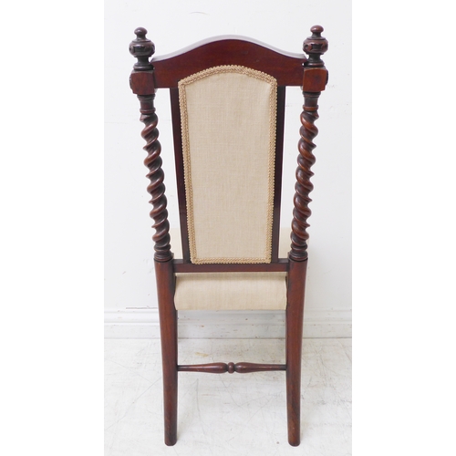 275 - A mid-19th century rosewood bedroom-style nursing chair of fine quality: arched top rail above two b... 