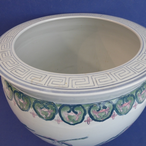 3 - A large Chinese porcelain carp bowl/planter of ovoid form: the lip with key fret design above a band... 