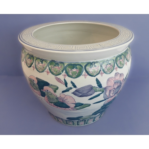 3 - A large Chinese porcelain carp bowl/planter of ovoid form: the lip with key fret design above a band... 