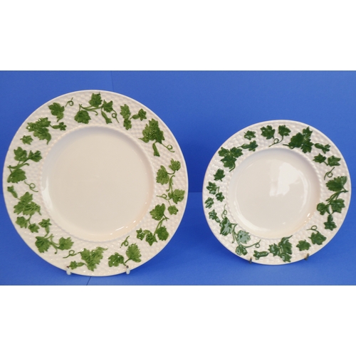 32 - An 82-piece Bordallo Pinheiro dinner and tea service:
 9 x 26 cm plates;
 46 x 20.5 cm plates;
 15 x... 