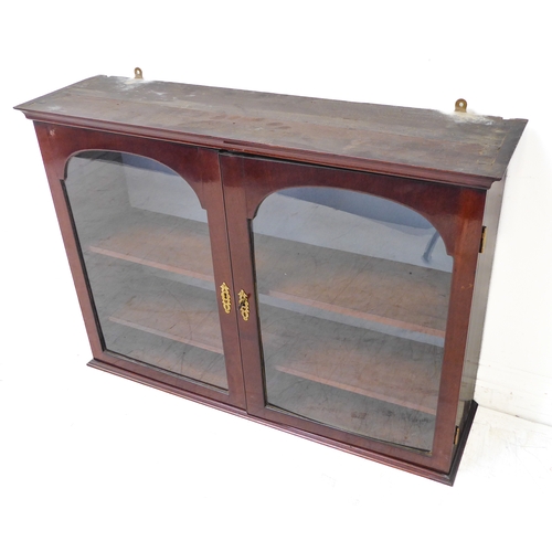 337 - A set of 19th century wall-hanging mahogany shelves: two glazed doors enclosing adjustable shelves (... 