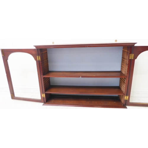 337 - A set of 19th century wall-hanging mahogany shelves: two glazed doors enclosing adjustable shelves (... 