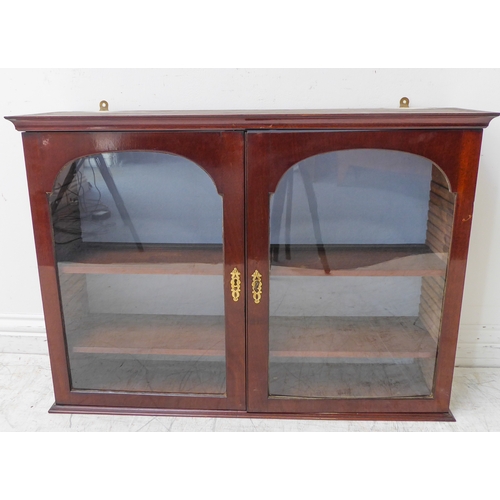 337 - A set of 19th century wall-hanging mahogany shelves: two glazed doors enclosing adjustable shelves (... 