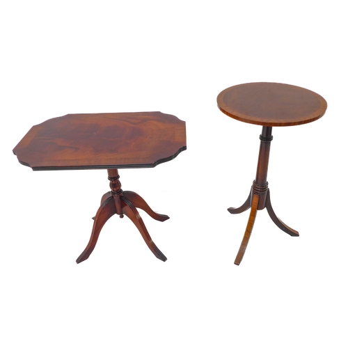 347 - A reproduction tilt-top occasional table with crossbanded top above turned stem and four downswept r... 