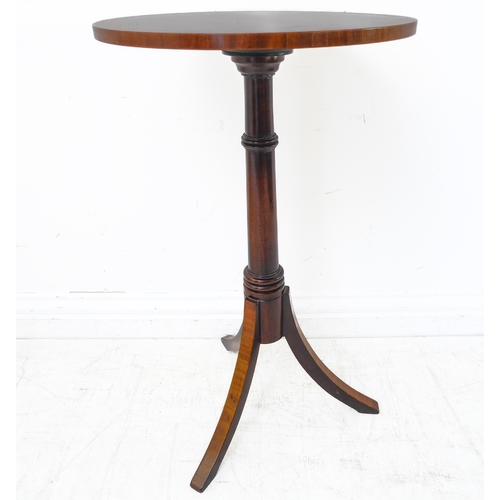 347 - A reproduction tilt-top occasional table with crossbanded top above turned stem and four downswept r... 