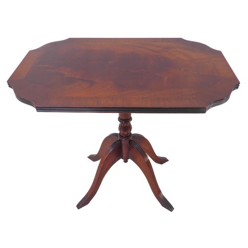 347 - A reproduction tilt-top occasional table with crossbanded top above turned stem and four downswept r... 