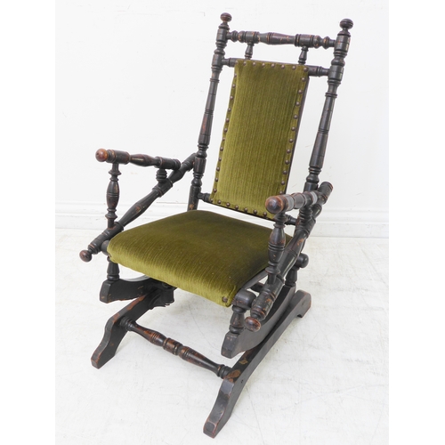 352 - An early 20th century American-style child's stained-wood upholstered rocking chair (42cm wide x 69c... 