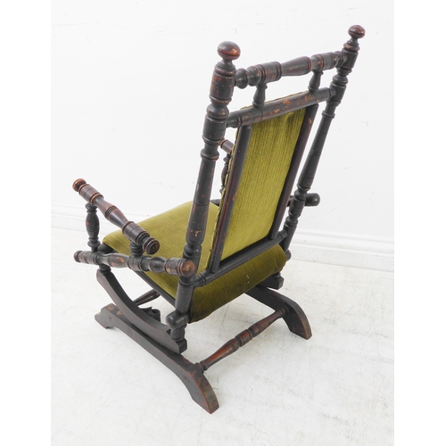 352 - An early 20th century American-style child's stained-wood upholstered rocking chair (42cm wide x 69c... 