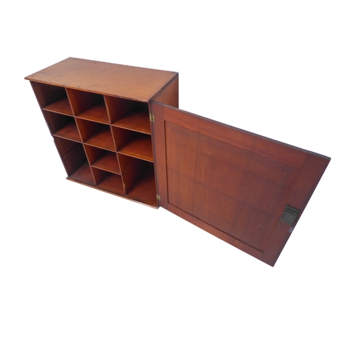 355 - A 19th century mahogany cabinet with single panelled door opening to reveal ten pigeonholes (51cm wi... 