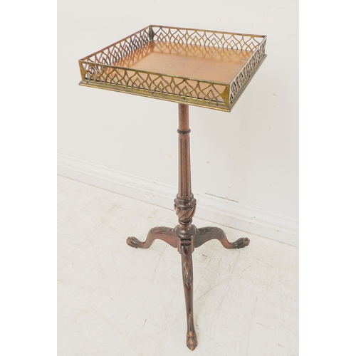 362 - An early 20th century mahogany tripod table: square top with pierced gilt-metal gallery, slender tur... 