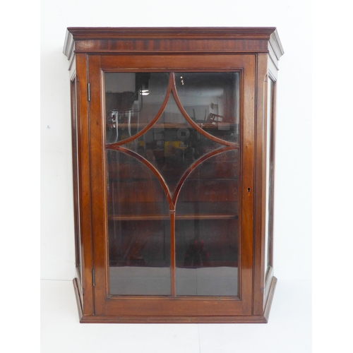 370 - A late 19th / early 20th century mahogany display cabinet of unusual proportions: three-quarter gall... 