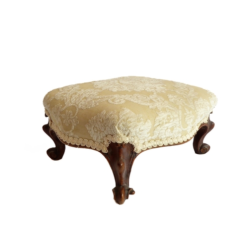 373 - A small mid-19th century walnut stool in mid-18th century Louis XV style: later upholstered top abov... 