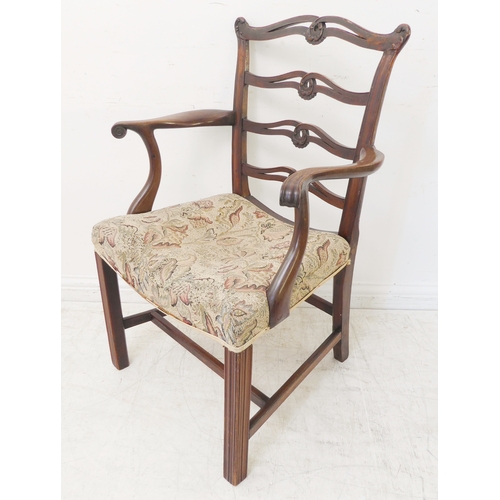 380 - An 18th century style (later reproduction) open arm mahogany ladderback carver chair of generous pro... 