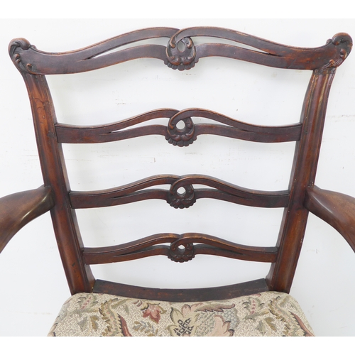 380 - An 18th century style (later reproduction) open arm mahogany ladderback carver chair of generous pro... 