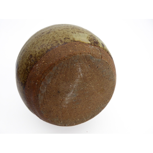 43 - A glazed studio pottery vase of ovoid form (possibly Winchcombe ?): monogrammed stamp lower unglazed... 