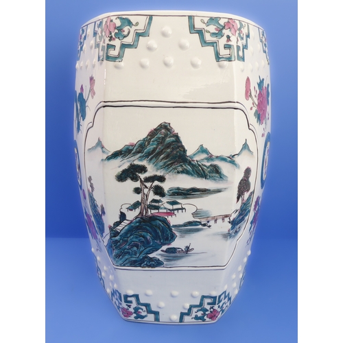 52 - A hexagonal Chinese ceramic garden seat decorated with flowers and lanterns (32cm wide x 48cm high)