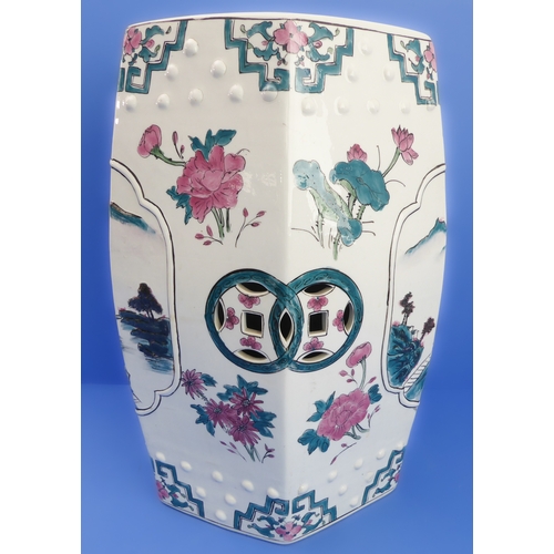 52 - A hexagonal Chinese ceramic garden seat decorated with flowers and lanterns (32cm wide x 48cm high)