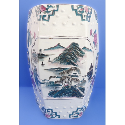 52 - A hexagonal Chinese ceramic garden seat decorated with flowers and lanterns (32cm wide x 48cm high)