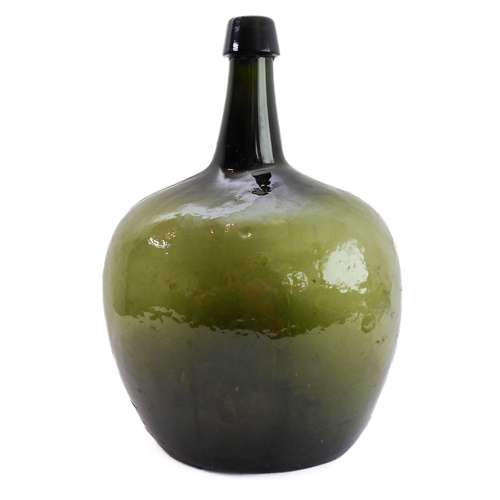 56 - A large and unusual 19th century green-glass bottle (probably for spirits) of squat ovoid form with ... 