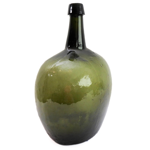 56 - A large and unusual 19th century green-glass bottle (probably for spirits) of squat ovoid form with ... 