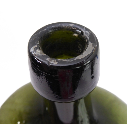 56 - A large and unusual 19th century green-glass bottle (probably for spirits) of squat ovoid form with ... 