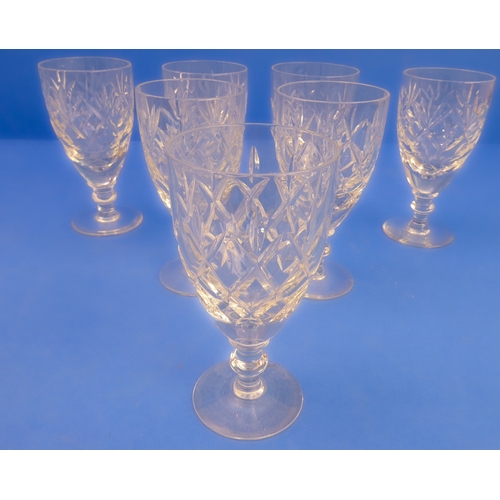 61 - A very good selection of mostly cut glassware comprising:
 a cut-glass tripod fruit bowl (12 cm high... 