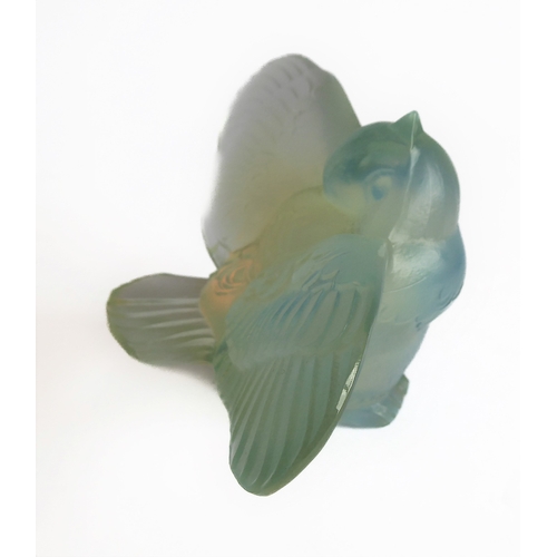 63 - An Art Deco style opalescent moulded glass paperweight modelled as an open-winged bird by Sabino, Fr... 