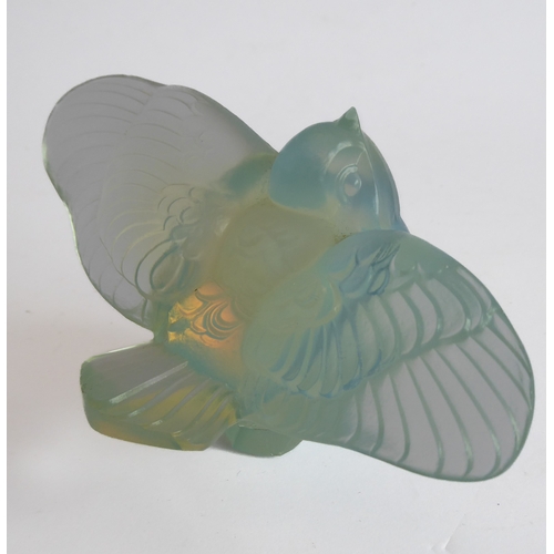 63 - An Art Deco style opalescent moulded glass paperweight modelled as an open-winged bird by Sabino, Fr... 