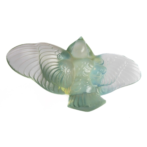 63 - An Art Deco style opalescent moulded glass paperweight modelled as an open-winged bird by Sabino, Fr... 