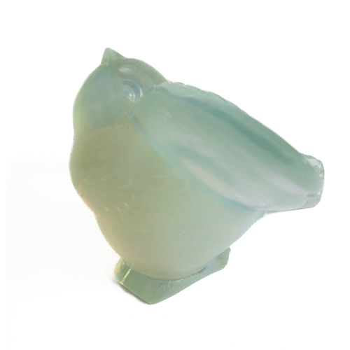 63 - An Art Deco style opalescent moulded glass paperweight modelled as an open-winged bird by Sabino, Fr... 