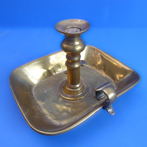 77 - A 19th century brass chamberstick and other metalware to include a pair of hallmarked silver peppere... 