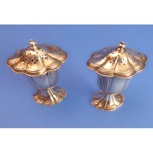 77 - A 19th century brass chamberstick and other metalware to include a pair of hallmarked silver peppere... 