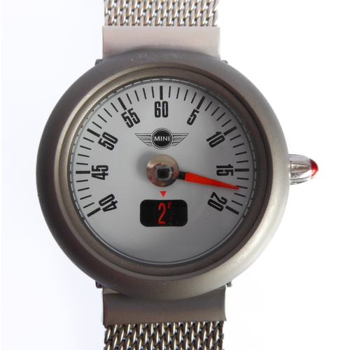 163 - A MINI stainless-steel-cased wristwatch with speedometer-style Arabic numerals and minute-hand, and ... 